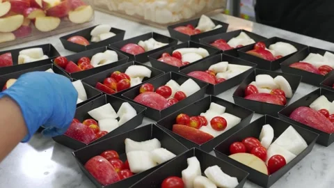 Chef Prepping Fresh Fruit Dessert Boxes in Professional Kitchen Stock Footage 343017992