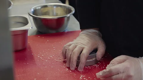 Chef pressing on the beef to shape the patty for cooking the hamburger Video stock 208368776