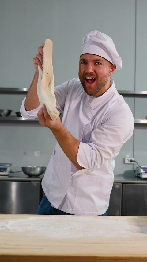 Chef pretends to sing with dough Stock Footage 299650684