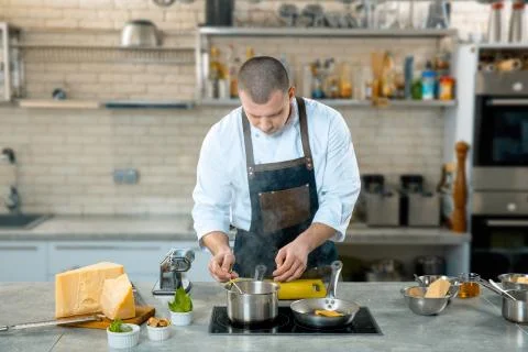 A chef in a process - preparing Italian dish Stock Photos