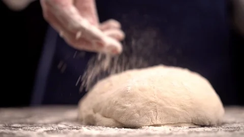 Chef in a professional kitchen prepares the dough with flour to make pasta Stock Footage 123916426