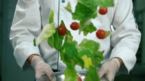 Chef professional preparing salad in an iron bowl Stock Footage 102661035