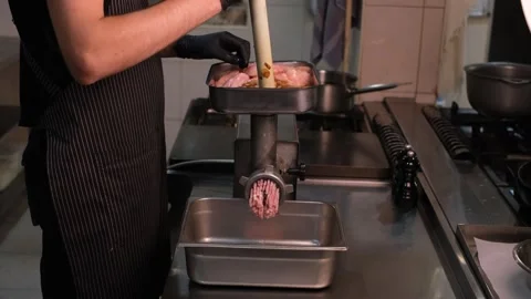 Chef in professional restaurant kitchen preparing minced chicken fillet side vie Stock Footage 334126660