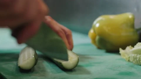 The chef professionally slices the cucumber. Stock Footage 172248058