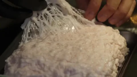 Chef Pulling Delicate Lacy Caul Fat Membrane for Meat Wrapping - Close Up Stock-Footage 347689233