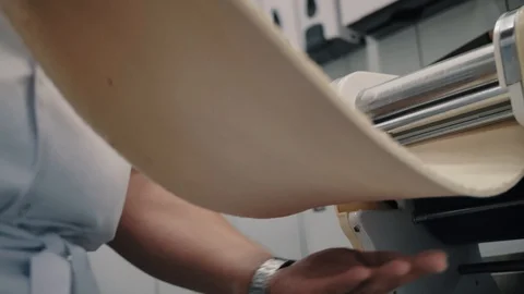 Chef pulls dough out of the mechanism Stock Footage 112592033