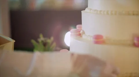 Chef push colorful macaroons on wedding cake. 動画素材 67197752