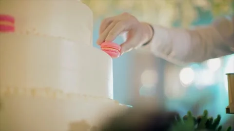 Chef push colorful macaroons on wedding cake. 動画素材 67197788