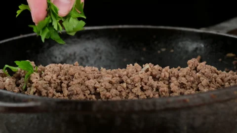 Chef put chopper parsley over minced meat, close up Stock Footage 202202884