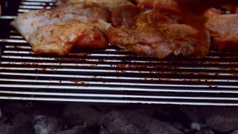 The chef put new meat chicken pieces on a barbecue grill 4K Stock Footage 116119657
