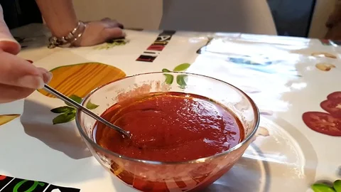 Chef put tomatoes sauce Stock Footage 127892990