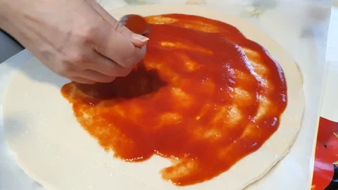 Chef put tomatoes sauce Stock Footage 127893739