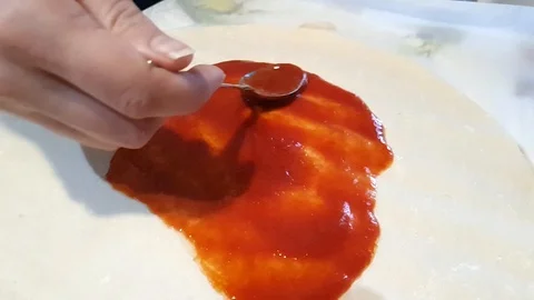 Chef put tomatoes sauce Stock Footage 127894398