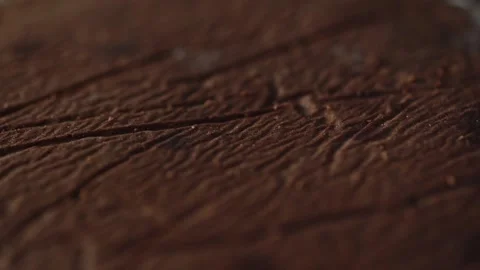 Chef puts apricot jam on a cake cake surface with a spoon making a layer Stock Footage 131232166