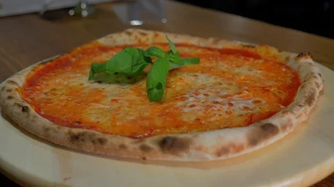 Chef puts basil on pizza Stock Footage 85007503
