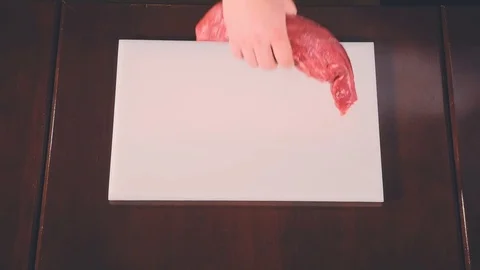 Chef puts the beef fillet on a cutting board Stock Footage 73303685