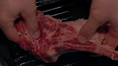 Chef puts beef steak on a hot grill pan in slow motion Stock Footage 221496207