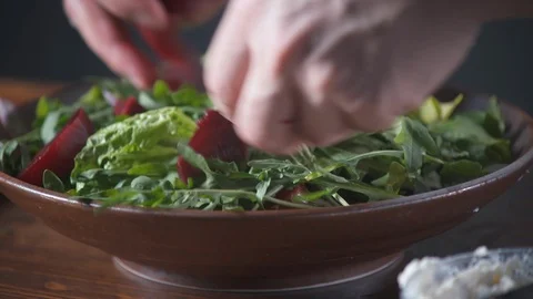 Chef puts boiled beets in a vegetarian salad in a restaurant. Food on cuisine. 스톡 동영상 124755708
