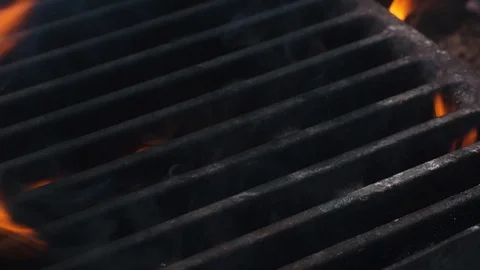 Chef puts a delicious piece of meat on the grill Stock-Footage 107768669