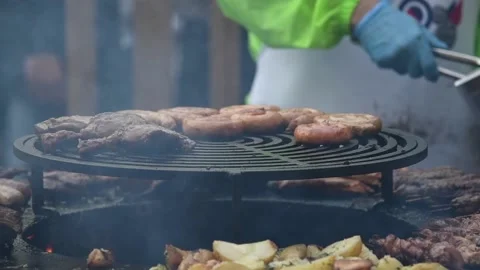 Chef puts duck leg on grill Stock Footage 209643673