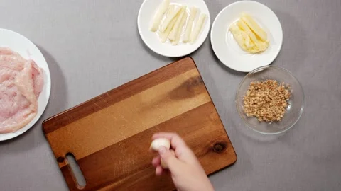 Chef puts a few cloves of garlic Stock-Footage 165258976