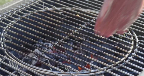 Chef puts fresh meat on the grill Stock Footage 107325858