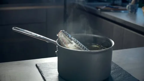 Chef puts fresh pink salmon to the pan Stock Footage 143779149