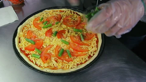 Chef puts green beans on pizza Stock Footage 41921317