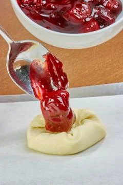 Chef puts jam on the dough cheesecakes with jam Complete Series Food recipe Stock Photos