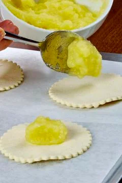 Chef puts jam on the dough cheesecakes with jam Complete Series Food recipe Stock Photos