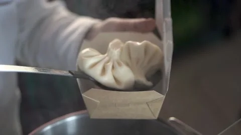 The chef puts khinkali in the package Stock Footage 152467963
