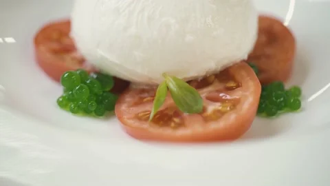 The chef puts a leaf in the finished dish Video stock 148499605