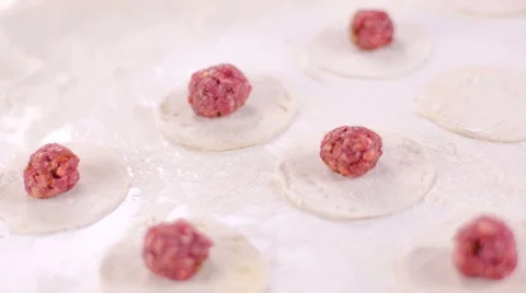 Chef puts meat ball on dough Stock Footage 49106298