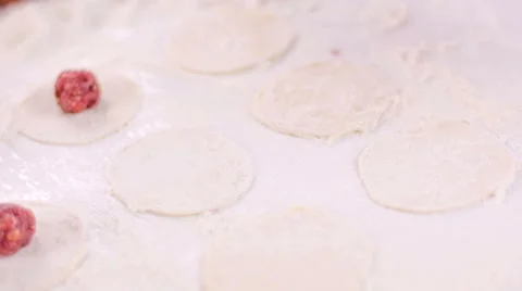 Chef puts meat ball on dough Stock Footage 49202466