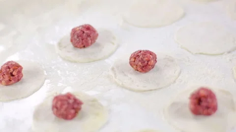 Chef puts meat ball on dough Stock Footage 49231018
