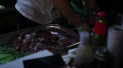 Chef puts the meat in the pan Video stock 64871958