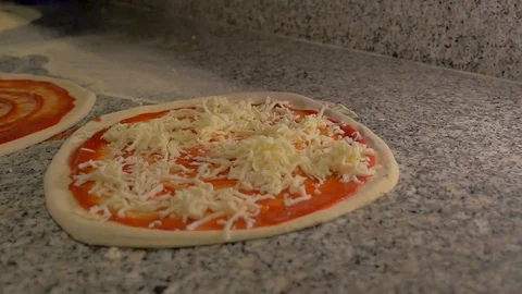 Chef puts mozzarella on pizza Stock Footage 85007539