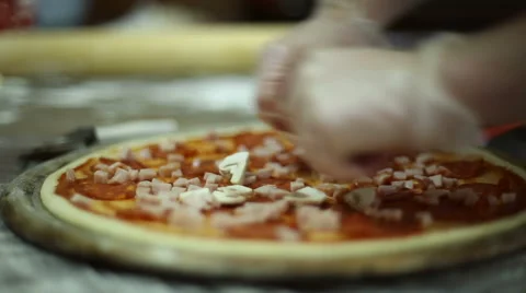 The chef puts the mushrooms on dough Stock Footage 59699610