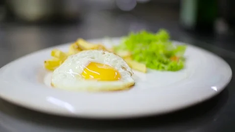 Chef puts omelet on a plate Stock Footage 70172149
