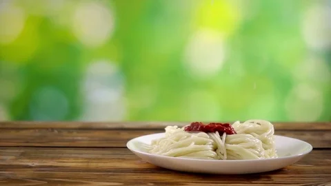 Chef puts parmesan on pasta Stock Footage 83043426