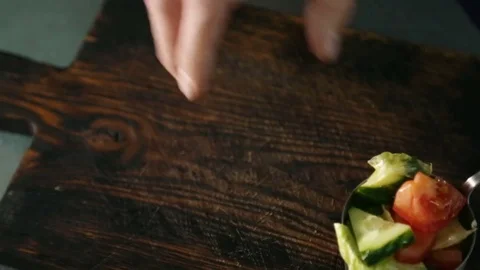Chef puts a piece of meat on the board Stock Footage 70528549