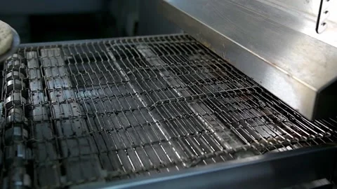 Chef puts pizza in the oven Stock-Footage 134955239
