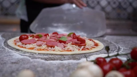 The chef puts pizza in the oven Video stock 135313058