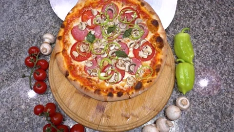 The chef puts pizza on the table Stock Footage 135312729