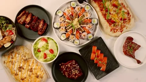 The chef puts a plate of food on the table Stock Footage 323388822
