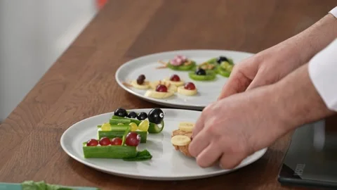 The chef puts the products on the plate Stock Footage 183559565