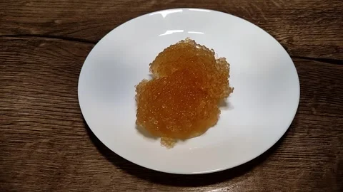 The chef puts red caviar on a plate Video stock 328032527