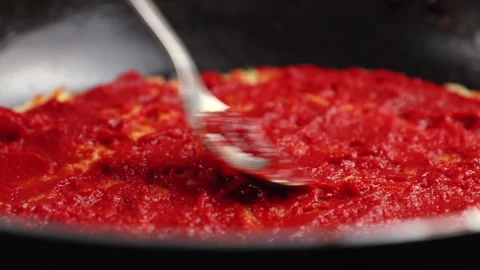 Chef puts red tomato paste or sauce on a basic potato pizza Stock Footage 145332122