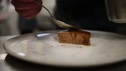 The chef puts the sauce on meat Stock Footage 169369301