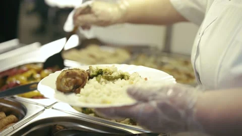 Chef puts stuffed sweet peppers on a plate Video stock 154850019